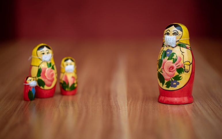 socially-distanced Russian matryoshka dolls with face masks