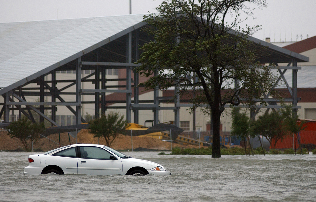 A car drifts in a flood.