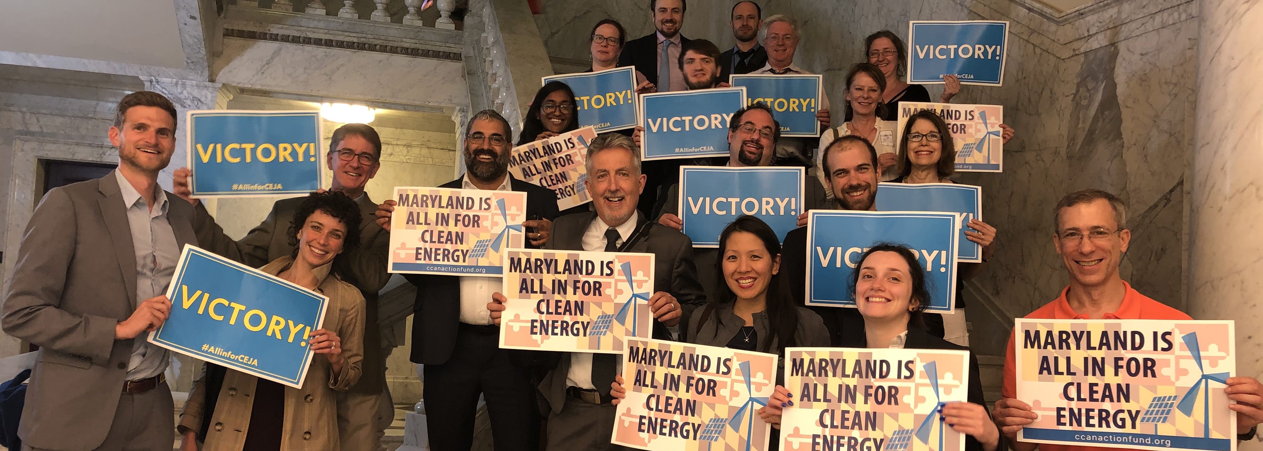 CCAN staff, interns and supporters pose for a victory shot right after the passage of the Clean Energy Jobs Act.